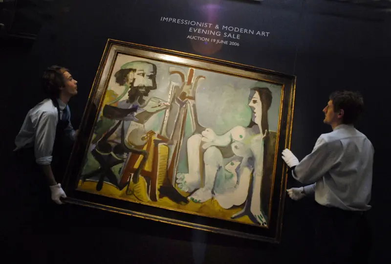 Two men carry a valuable painting